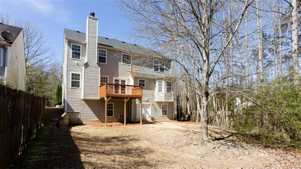 3721 Bogan Mill Road Northeast Buford, GA 30519 - Photo 53 of 58 a front view of a house with a yard covered with snow in front of house