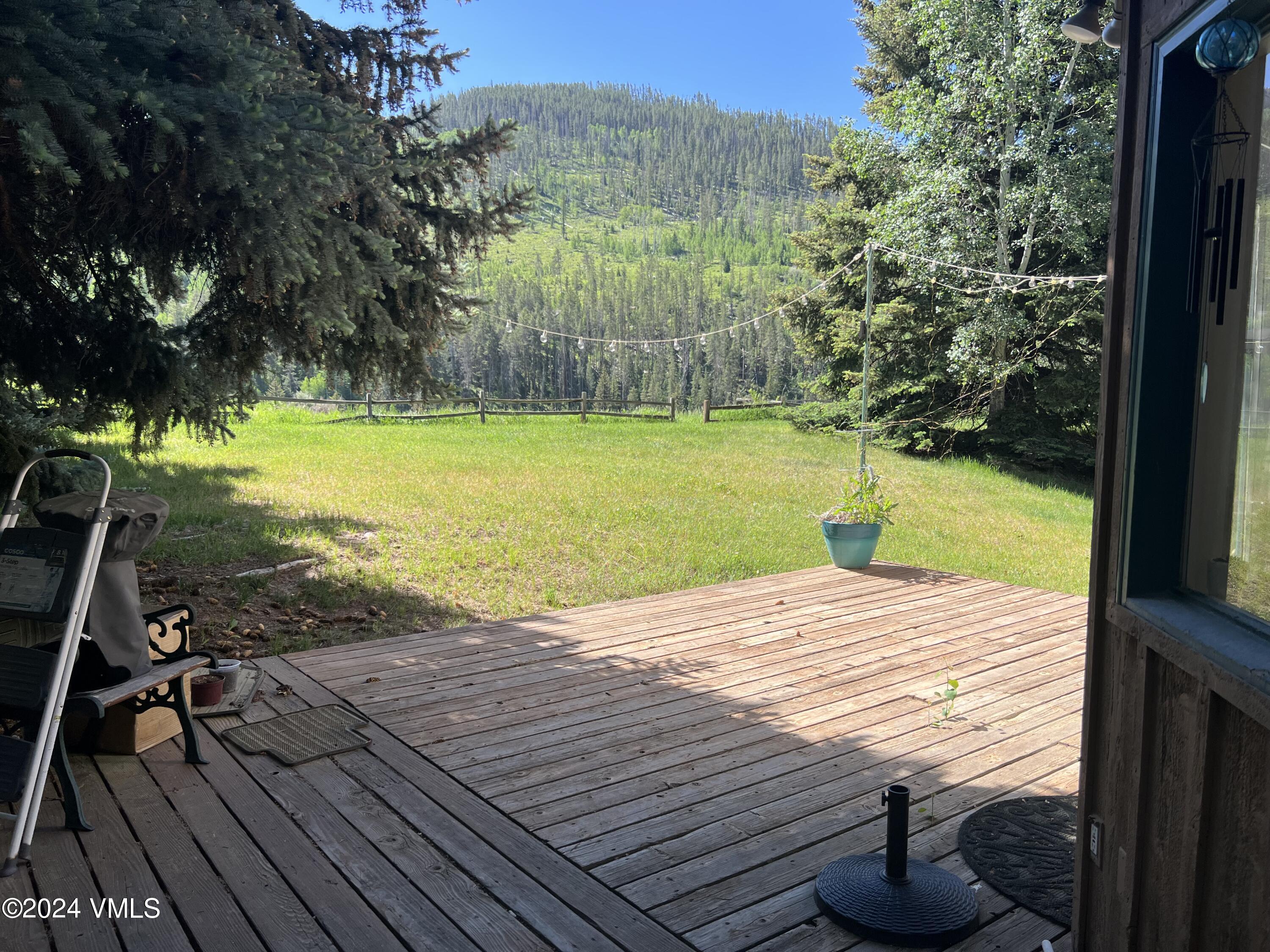 2450 Chamonix Lane, Unit 4 Vail, CO 81657 - Photo 2 of 7 a view of a swimming pool with an outdoor space and seating area