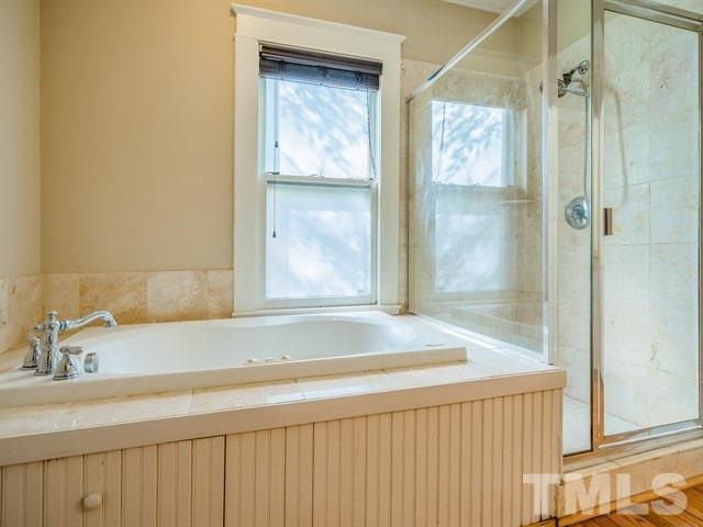 613 Rosemont Avenue Raleigh, NC 27607 - Photo 22 of 28 a bathroom with a bathtub and a sink