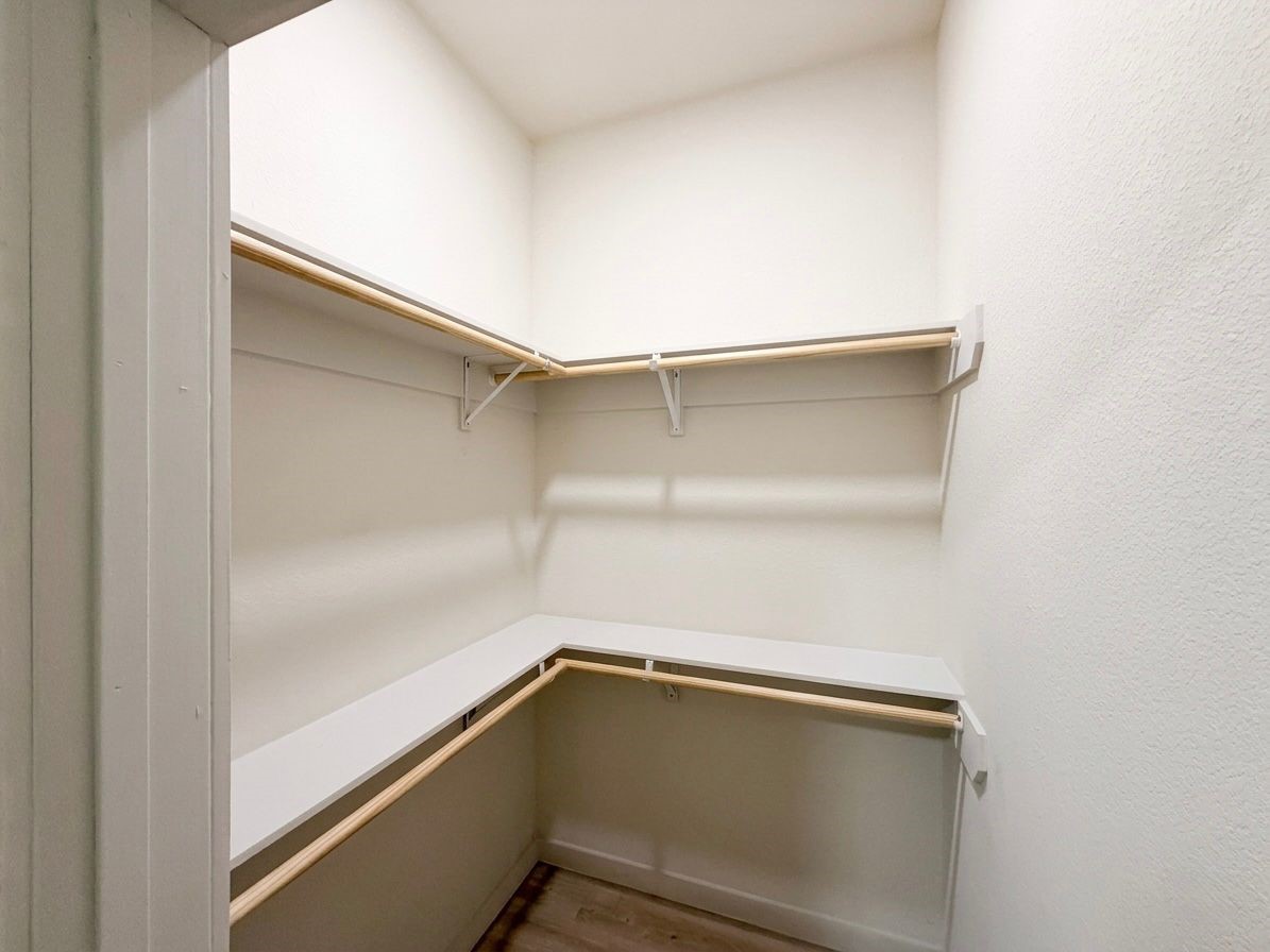 9740 Garcroft Street Houston, TX 77029 - Photo 14 of 17 a view of an empty walk in closet