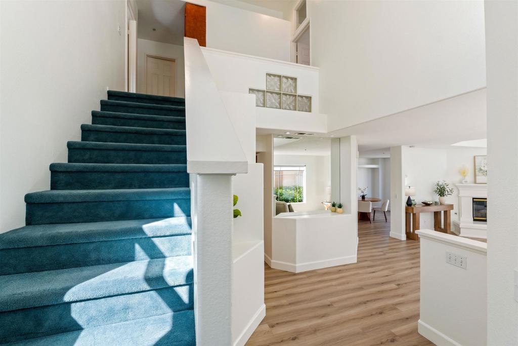 1831 Monserrat Way Vista, CA 92081 - Photo 16 of 46 a living room with furniture and wooden floor