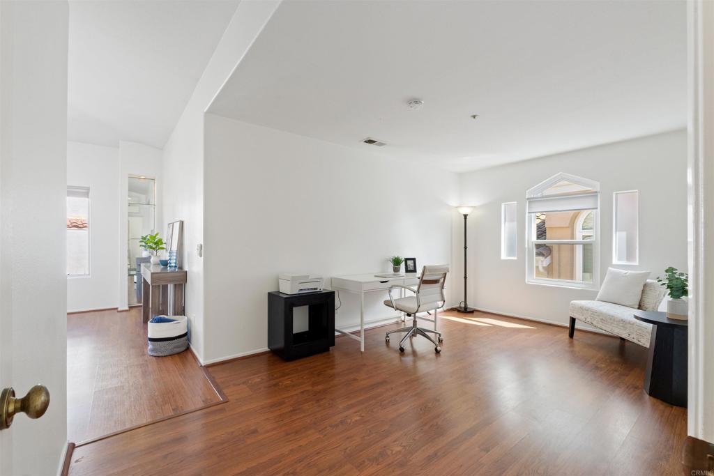 1831 Monserrat Way Vista, CA 92081 - Photo 17 of 46 a living room with furniture and a wooden floor
