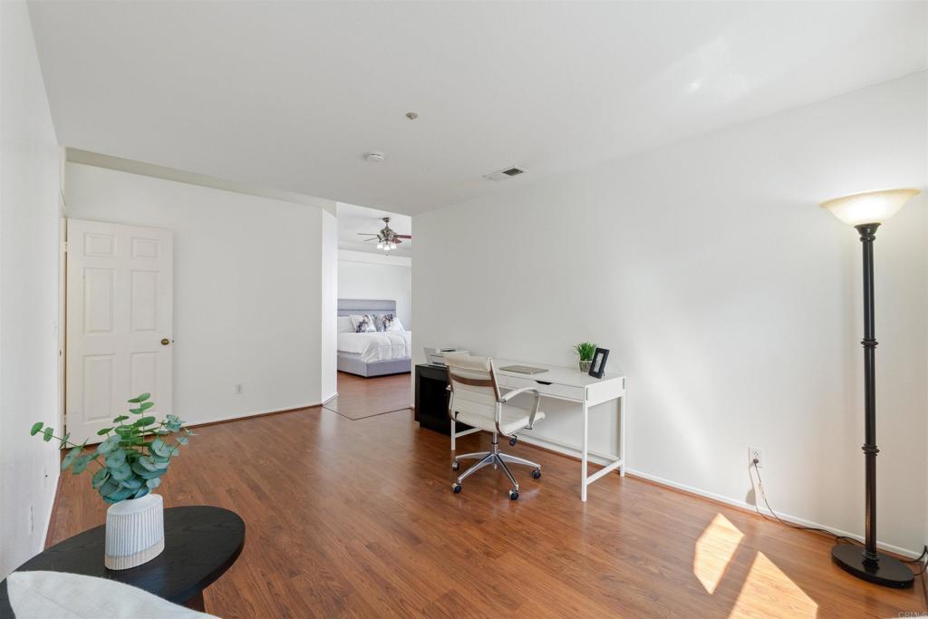 1831 Monserrat Way Vista, CA 92081 - Photo 18 of 46 a view of a workspace with furniture and a window