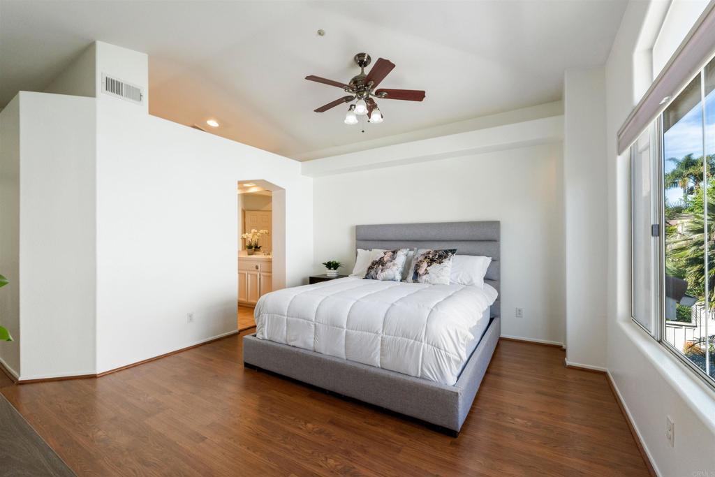 1831 Monserrat Way Vista, CA 92081 - Photo 20 of 46 a bedroom with a bed and window