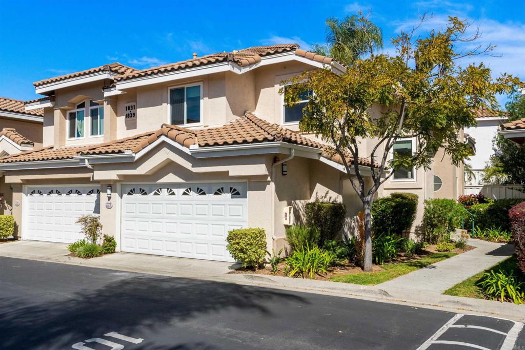 1831 Monserrat Way Vista, CA 92081 - Photo 2 of 46 a front view of a house with a yard