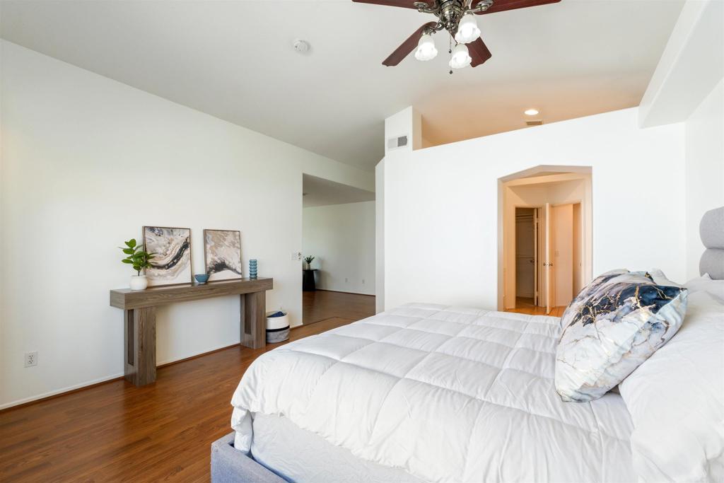 1831 Monserrat Way Vista, CA 92081 - Photo 21 of 46 a bedroom with a bed and a desk