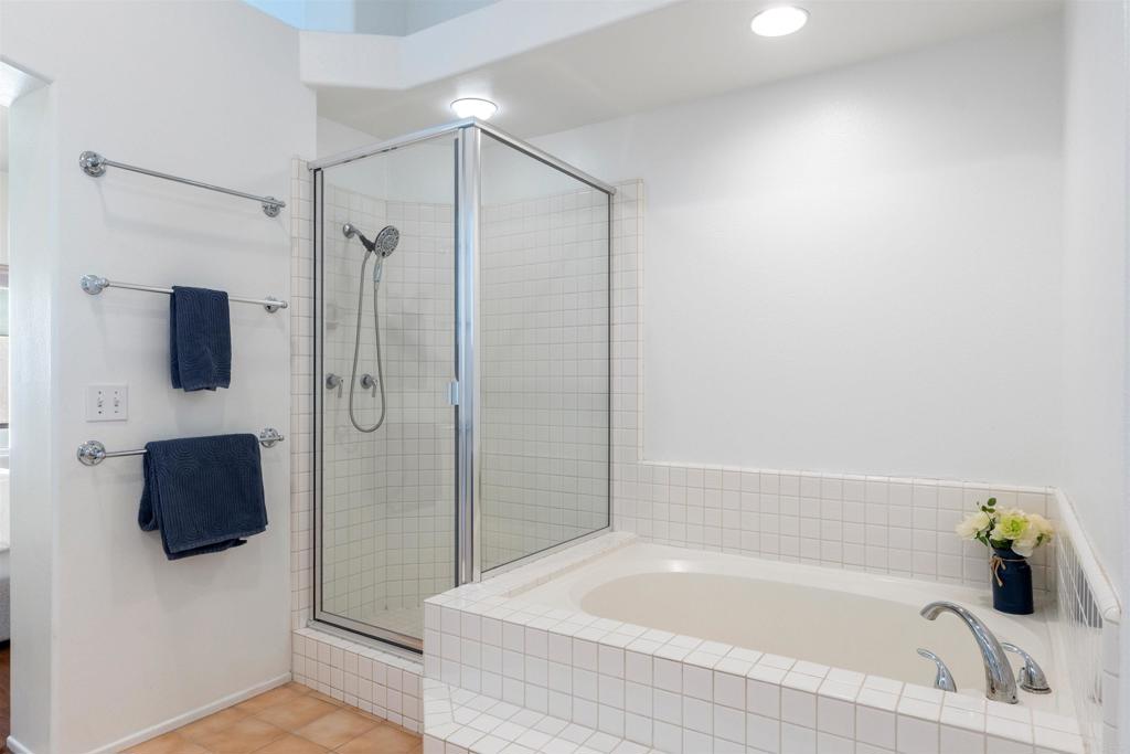 1831 Monserrat Way Vista, CA 92081 - Photo 24 of 46 a bathroom with a bathtub and a shower