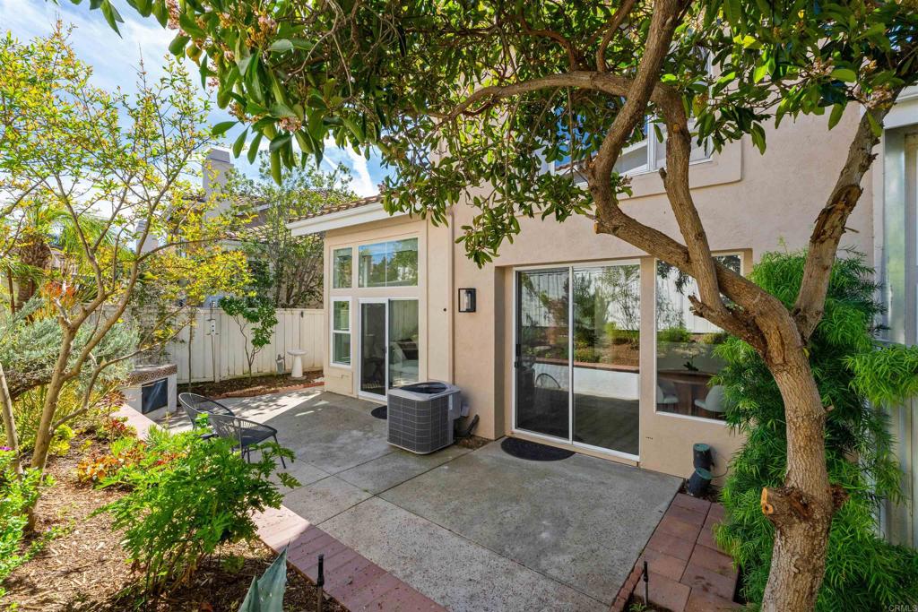 1831 Monserrat Way Vista, CA 92081 - Photo 35 of 46 front view of a house with a tree in front