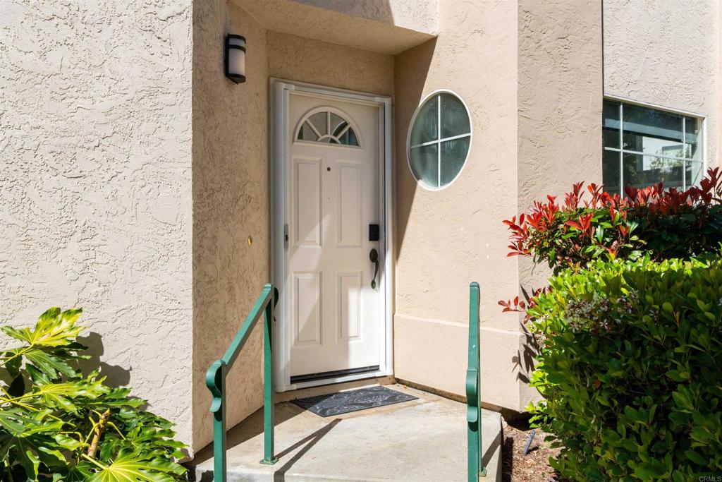 1831 Monserrat Way Vista, CA 92081 - Photo 5 of 46 a front view of a house with a garden