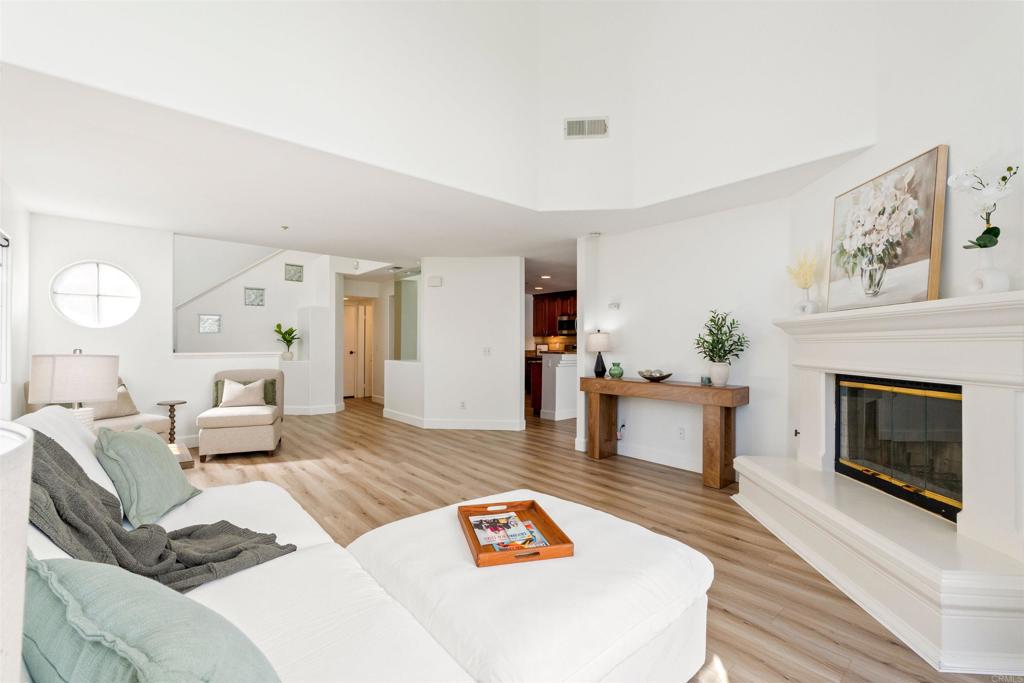 1831 Monserrat Way Vista, CA 92081 - Photo 8 of 46 a living room with furniture and a fireplace