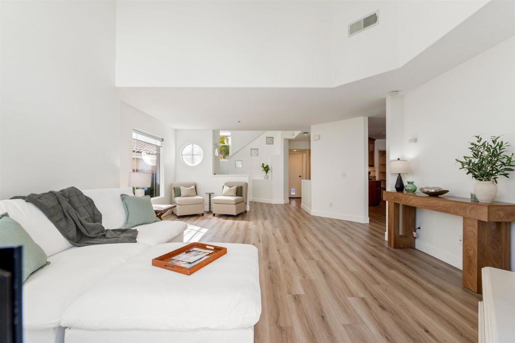 1831 Monserrat Way Vista, CA 92081 - Photo 9 of 46 a living room with furniture and wooden floor