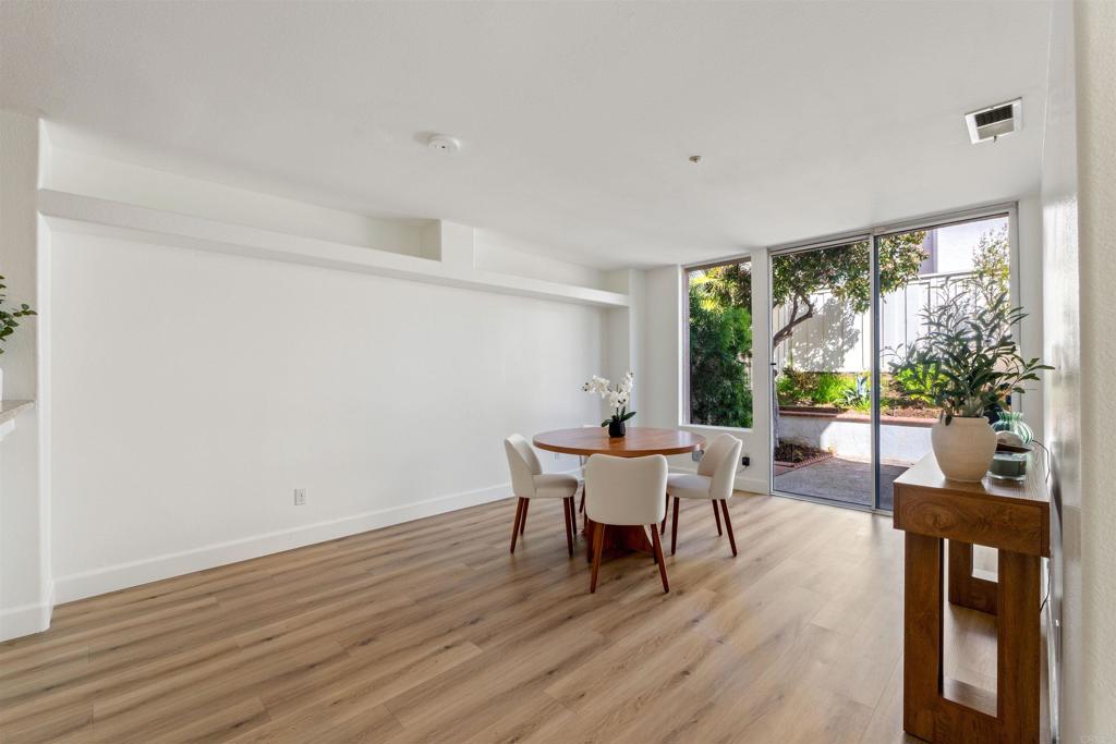 1831 Monserrat Way Vista, CA 92081 - Photo 10 of 46 a view of a dining room with furniture window and wooden floor