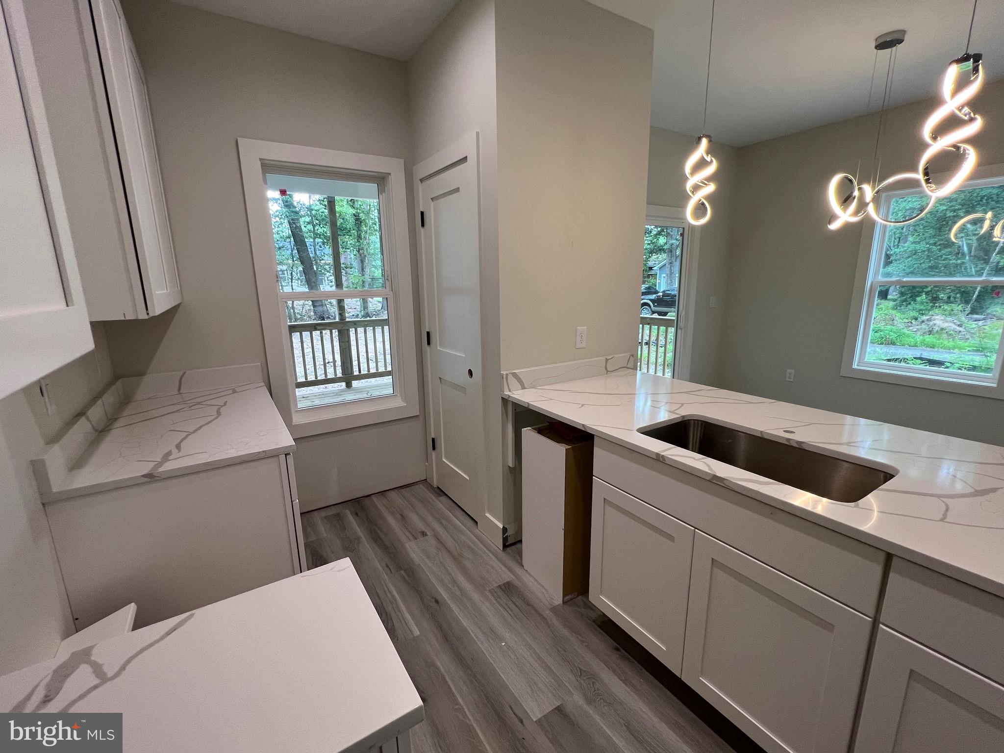 175 Rose Way Colonial Beach, VA 22443 - Photo 14 of 33 a kitchen with a refrigerator and a sink