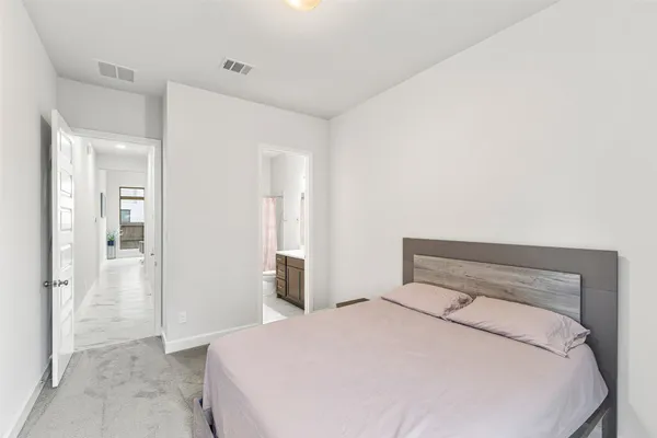 a bedroom with a bed and closet