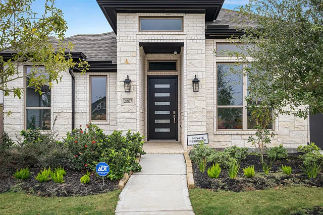 front view of a house with a yard