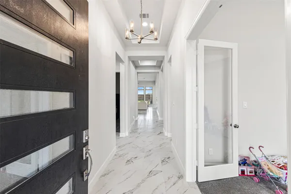 a view of a hallway view with staircase