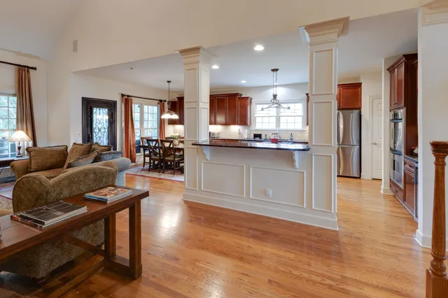 a large kitchen with a table and chairs
