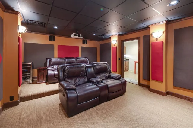 a living room with furniture and a projector