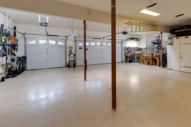 a view of a livingroom with furniture and a garage