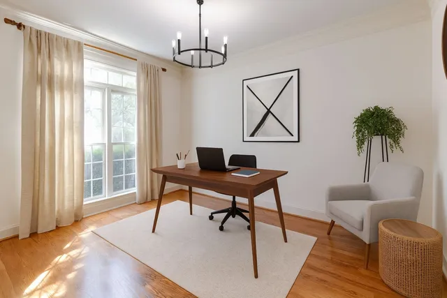 a workspace with furniture window and wooden floor