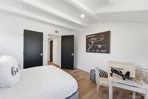 a bedroom with a bed and a table