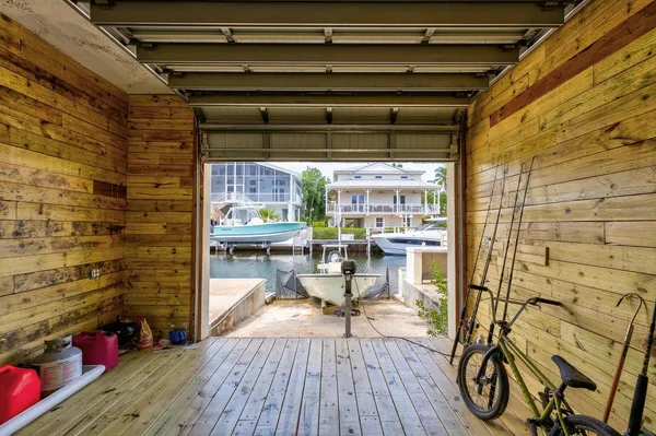 a view of house with yard outdoor seating area and barbeque oven