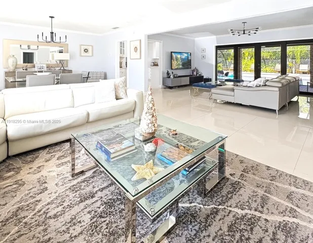 a view of a hallway with entryway door chandelier and front door