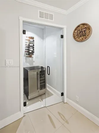 a spacious bedroom with a bed table chair and a window