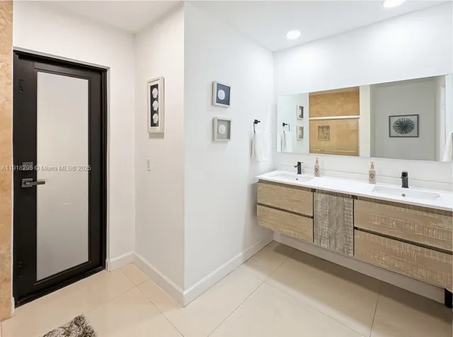 a view of a patio with a table and chairs