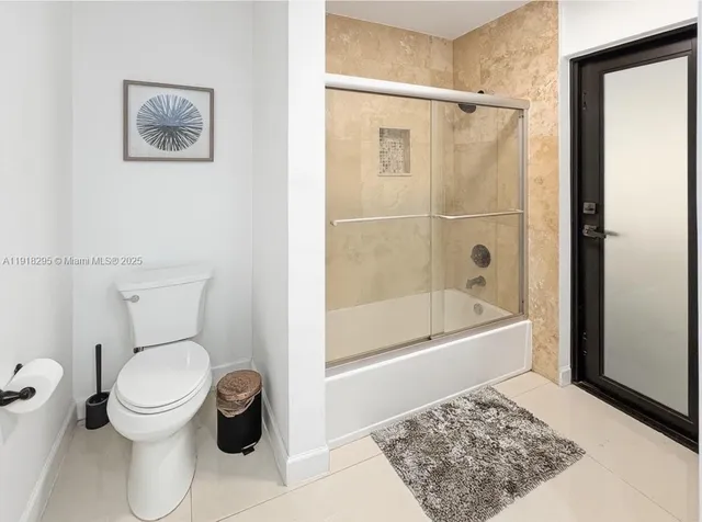 a sitting area with pool table and chairs