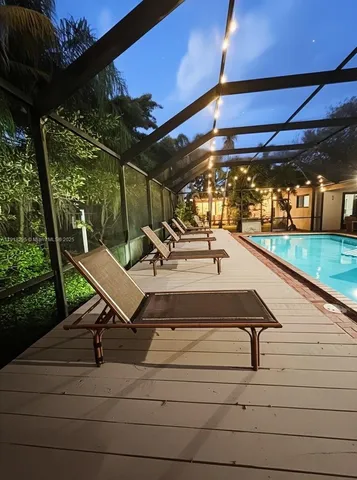 a living room with lots of furniture and a flat screen tv