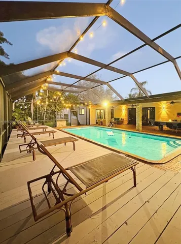a backyard of a house with table and chairs