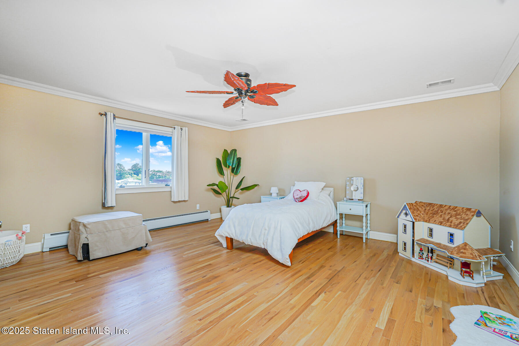 66 Normalee Road Staten Island, NY 10305 - Photo 29 of 54 a living room with furniture and a wooden floor