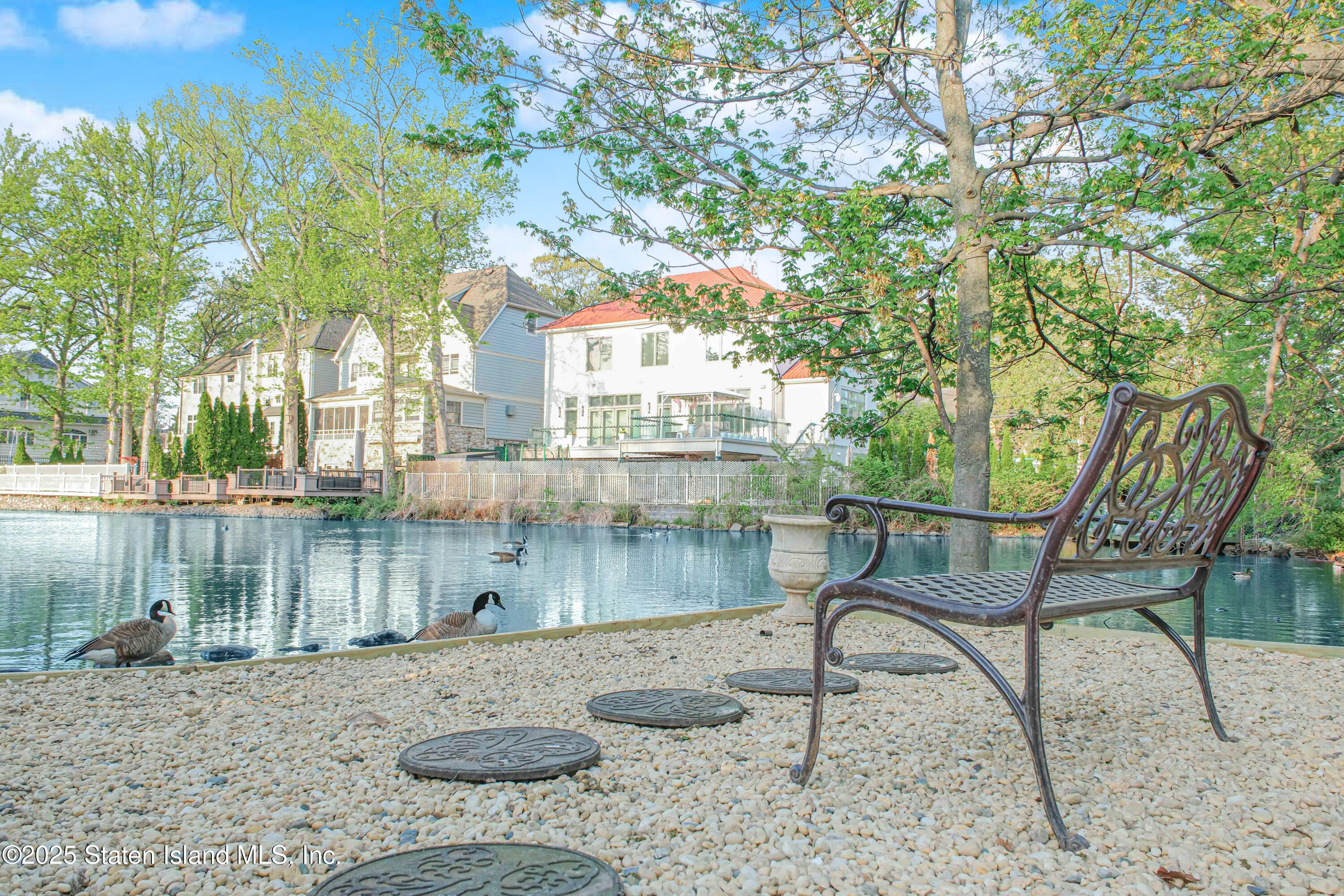 66 Normalee Road Staten Island, NY 10305 - Photo 42 of 54 a view of a lake with a patio