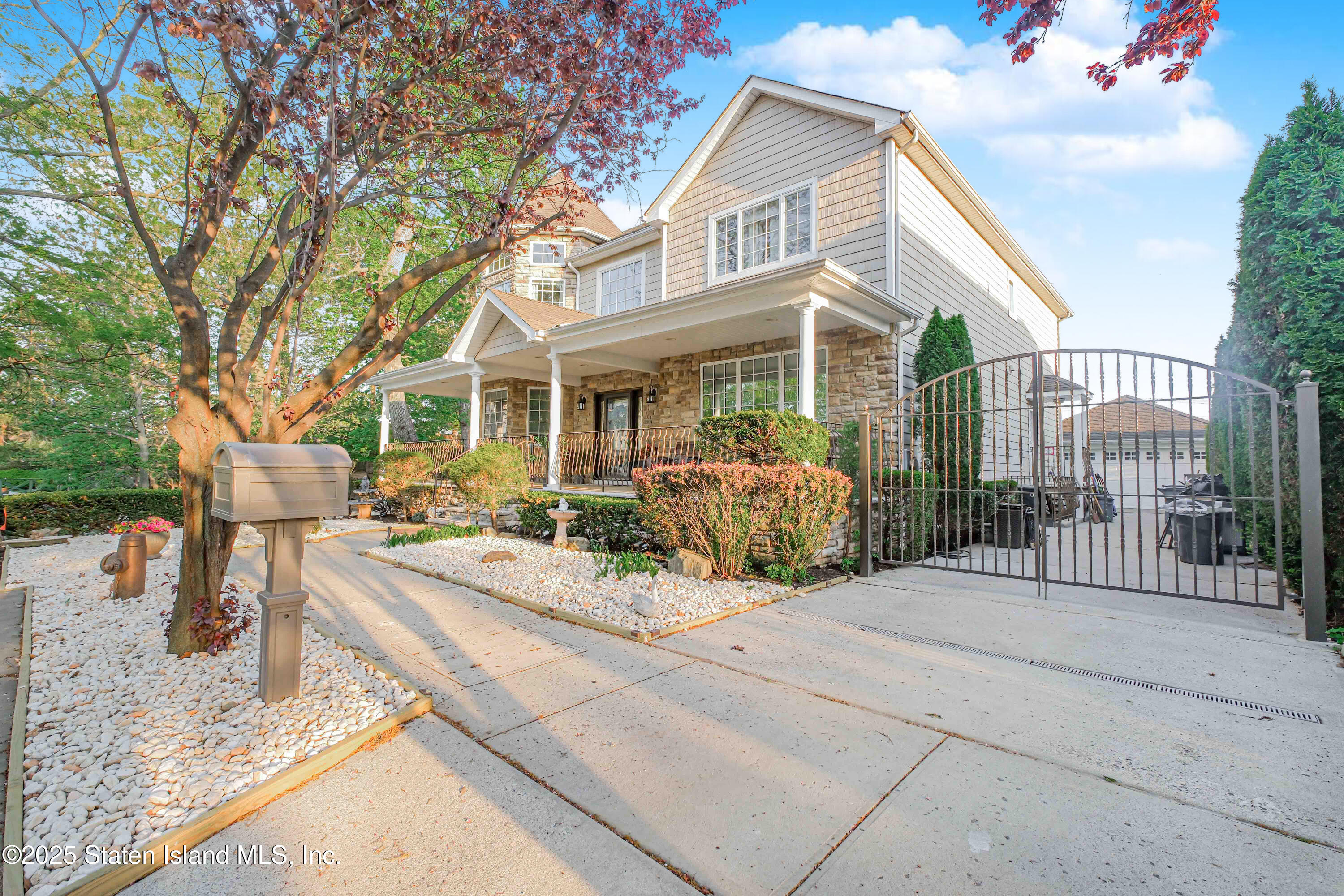 66 Normalee Road Staten Island, NY 10305 - Photo 53 of 54 a front view of a house with porch and furniture