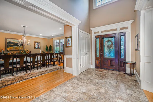a view of a living room and entryway