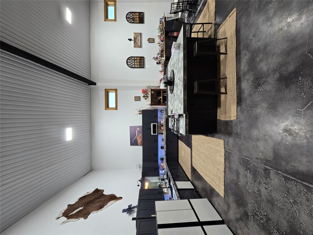 143 County Road Paige, TX 78659 - Photo 26 of 36 a living room with stainless steel appliances kitchen island granite countertop furniture and a large window