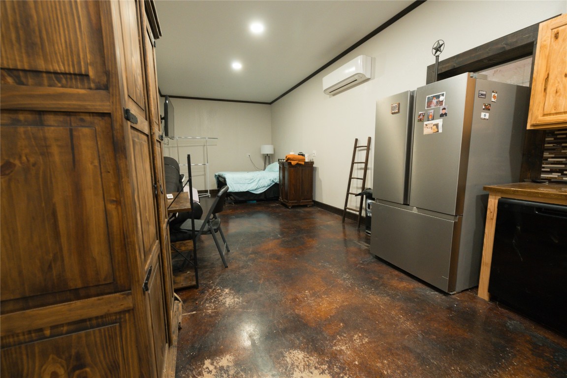 143 County Road Paige, TX 78659 - Photo 30 of 36 a view of a refrigerator in kitchen and utility room