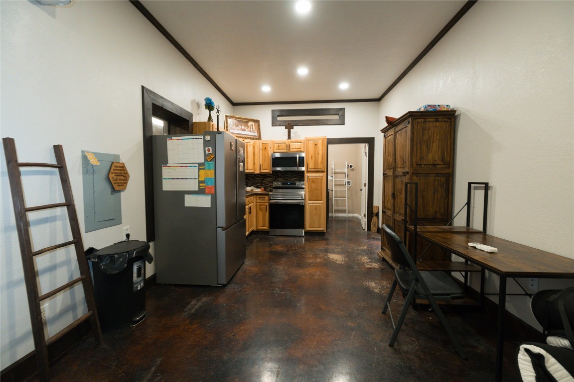 143 County Road Paige, TX 78659 - Photo 33 of 36 a kitchen with refrigerator and chairs