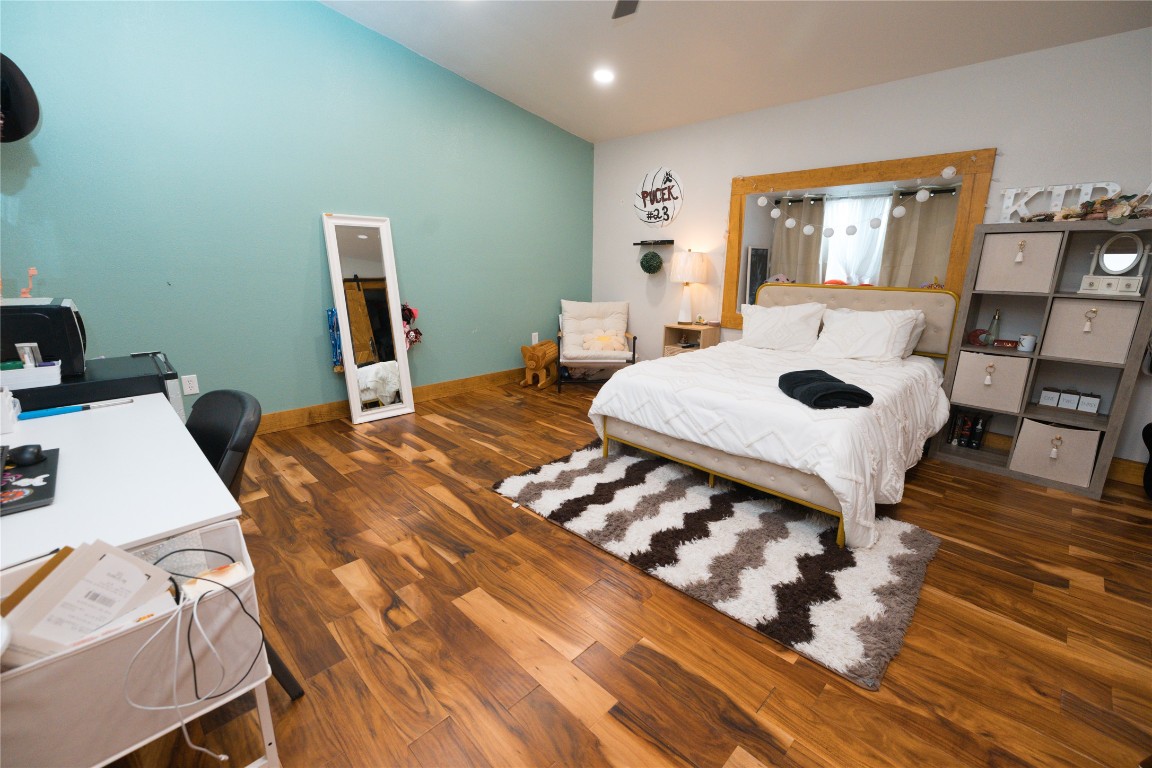 143 County Road Paige, TX 78659 - Photo 10 of 36 a bedroom with a bed and a table in it