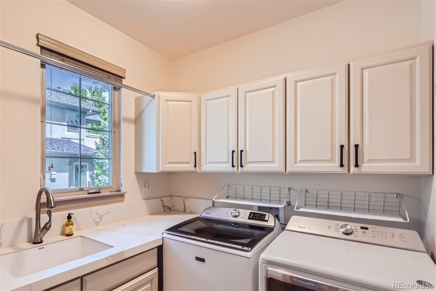722 Skywalker Point Lafayette, CO 80026 - Photo 13 of 47 a view of a kitchen with sink and cabinets