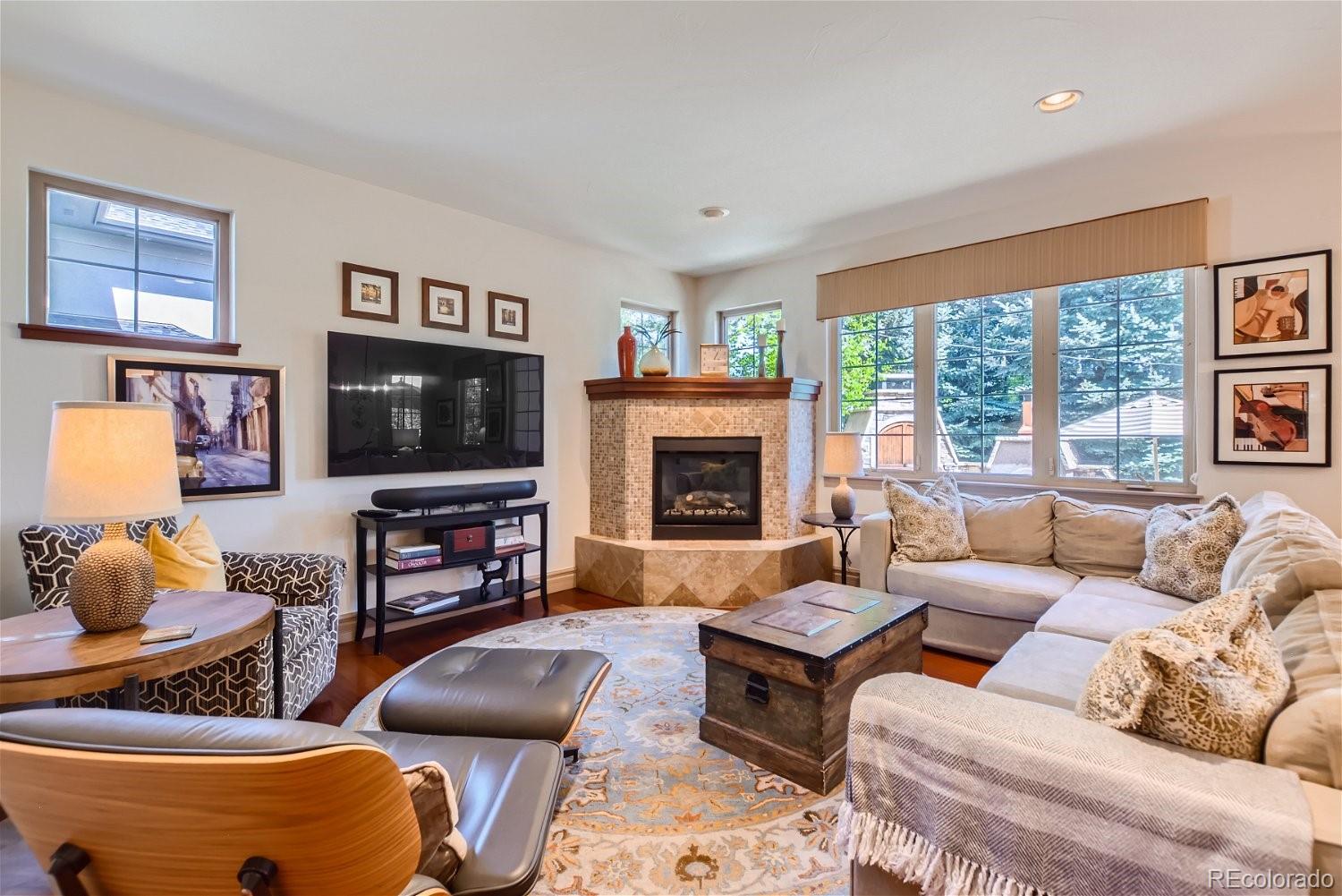 722 Skywalker Point Lafayette, CO 80026 - Photo 14 of 47 a living room with furniture and a flat screen tv