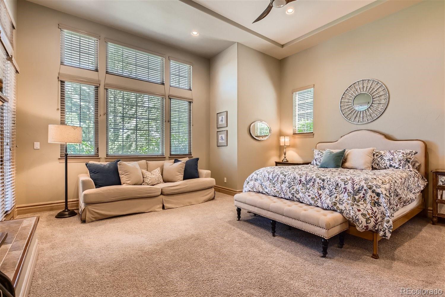 722 Skywalker Point Lafayette, CO 80026 - Photo 15 of 47 a bedroom with a bed couch and window