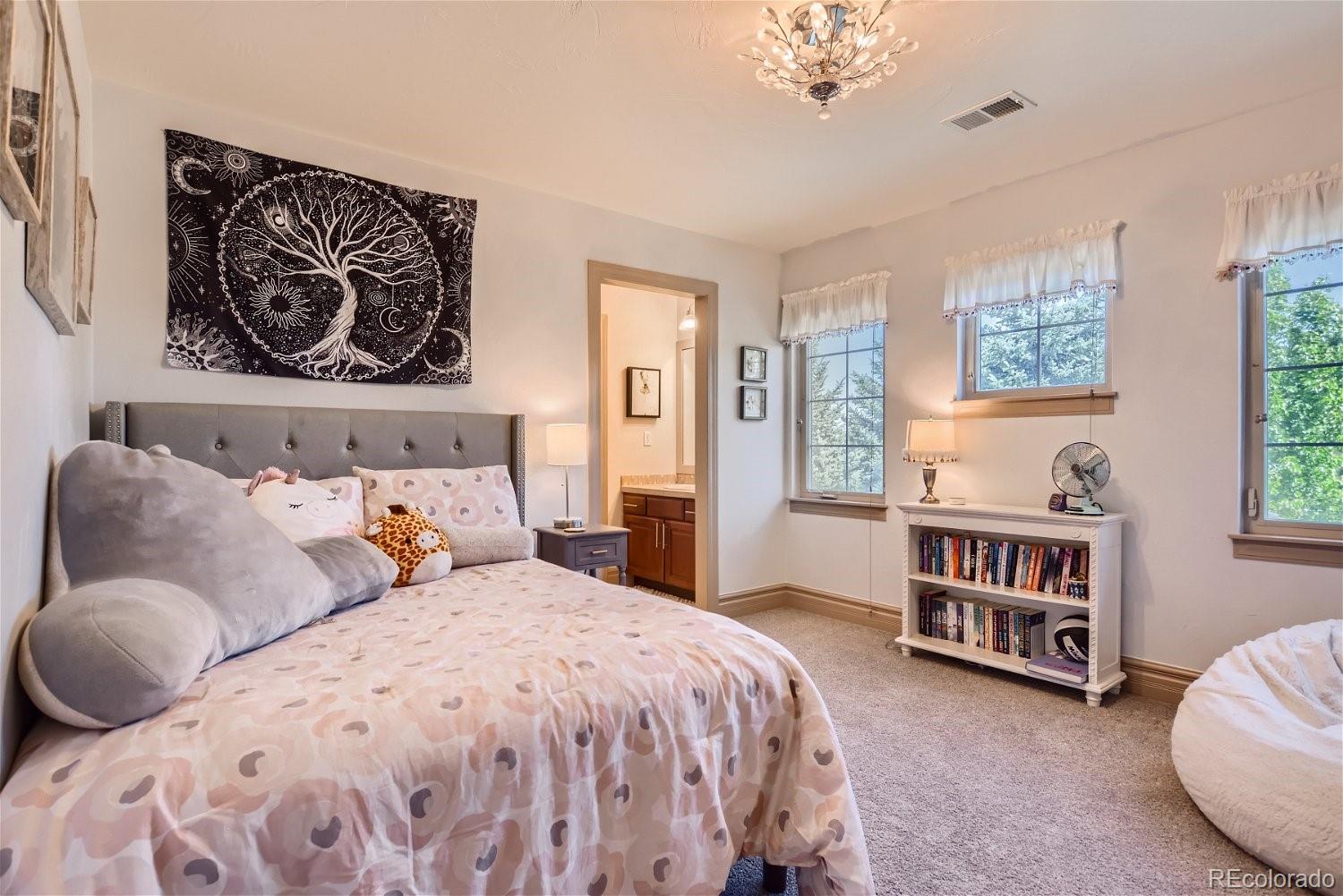 722 Skywalker Point Lafayette, CO 80026 - Photo 17 of 47 a bedroom with a bed and a couch