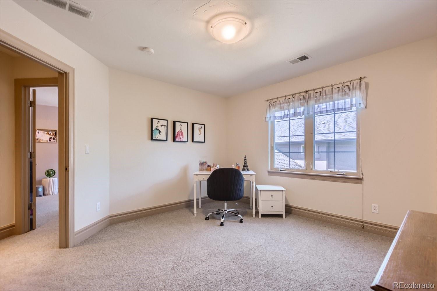 722 Skywalker Point Lafayette, CO 80026 - Photo 19 of 47 a living room with furniture and a window