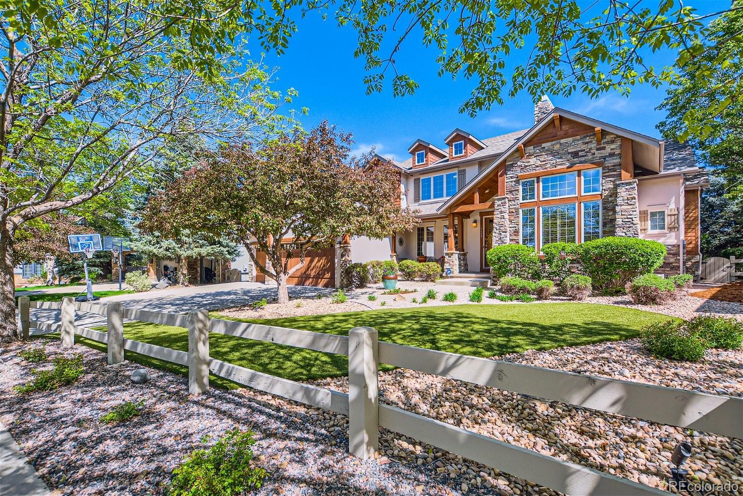 722 Skywalker Point Lafayette, CO 80026 - Photo 2 of 47 a front view of a house with a yard
