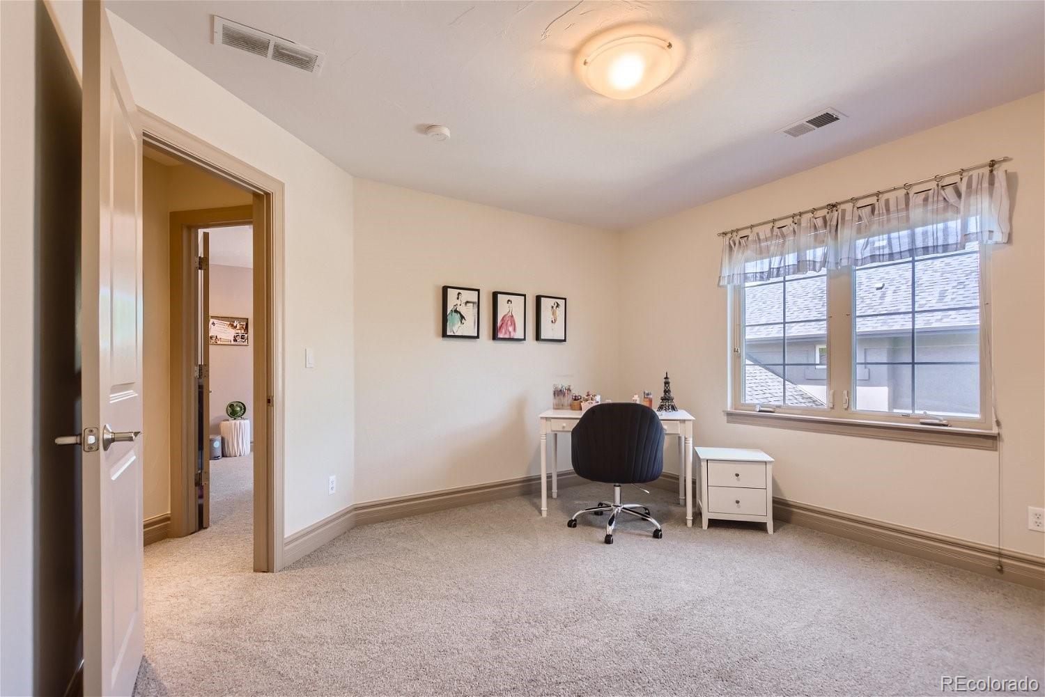 722 Skywalker Point Lafayette, CO 80026 - Photo 21 of 47 a view of a livingroom with workspace and a window