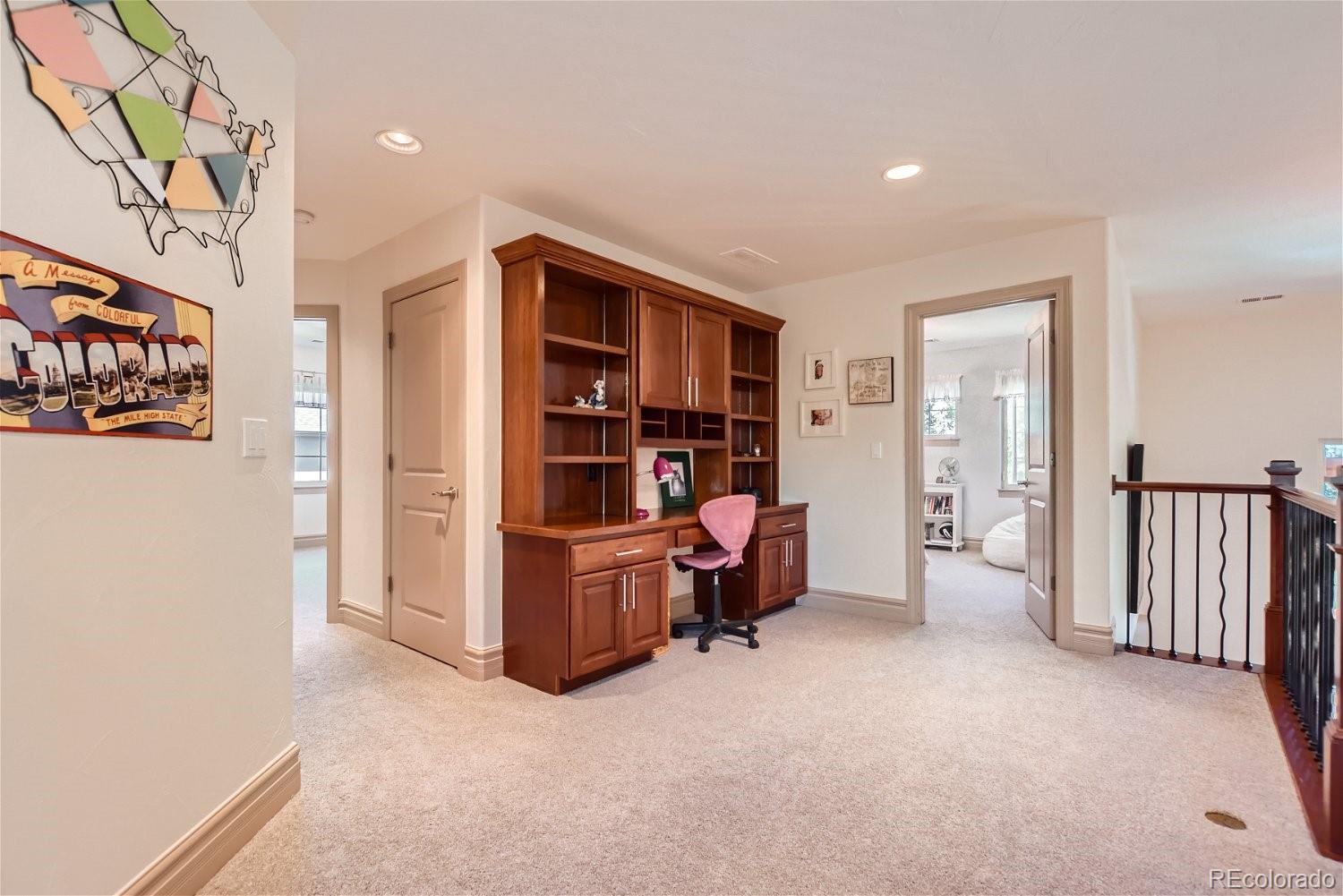 722 Skywalker Point Lafayette, CO 80026 - Photo 22 of 47 a view of a furniture and workspace in a room