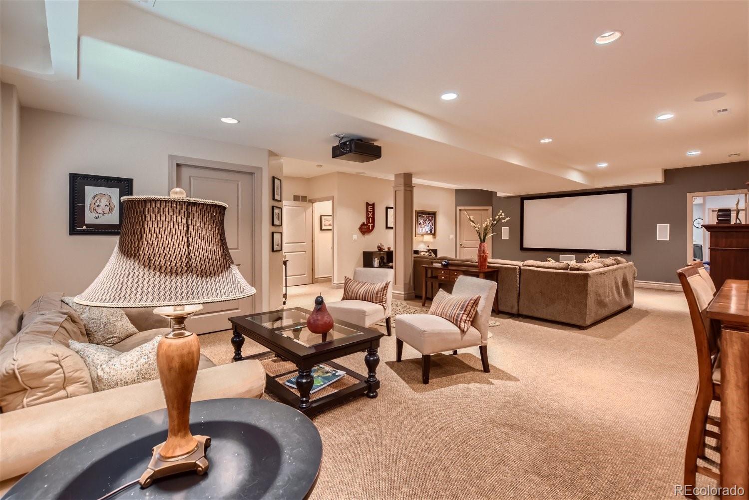 722 Skywalker Point Lafayette, CO 80026 - Photo 29 of 47 a living room with furniture and a flat screen tv