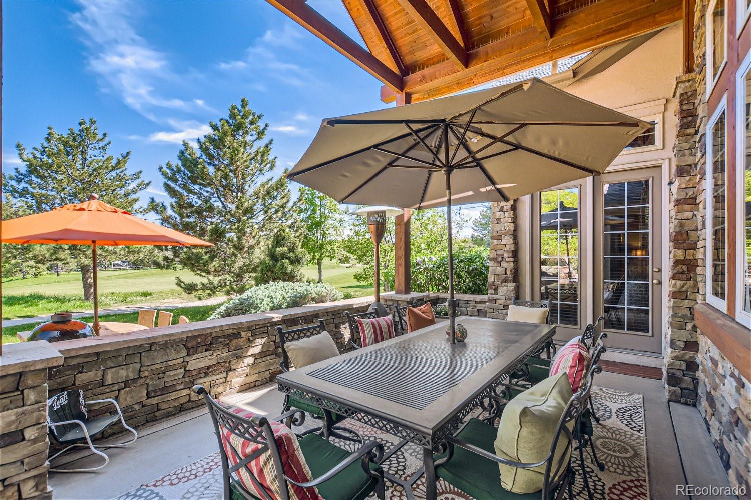 722 Skywalker Point Lafayette, CO 80026 - Photo 33 of 47 an outdoor space with furniture and umbrella